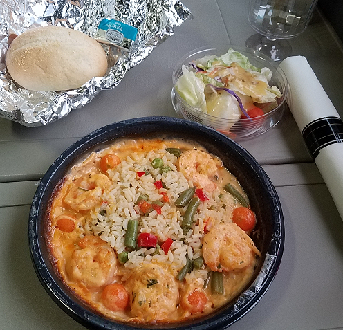 Shrimp with lobster sauce, roll, salad, utensils